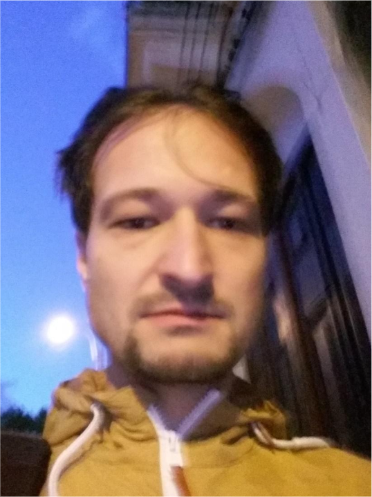 An out-of-focus face: soft edges and lost detail in the eyes and mouth